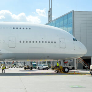 Airbus A380 A380 fuselage and front section from the side at the gate at the airport